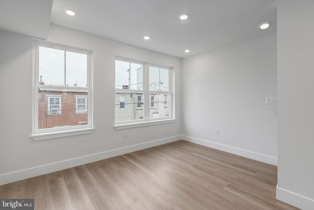 unfurnished room featuring light wood-type flooring