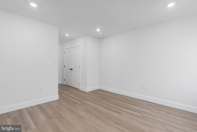 spare room featuring light hardwood / wood-style flooring