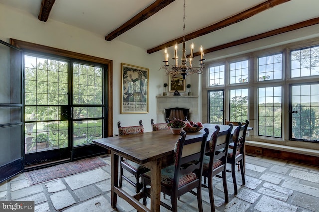 1601 Brintons Bridge Rd, Chadds Ford, PA 19317 - dining area with a fireplace, plenty of natural light, a notable chandelier, and beamed ceiling