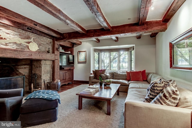 living room featuring wood-type flooring and beam ceiling