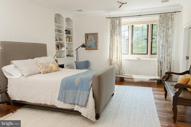 bedroom with wood-type flooring and crown molding