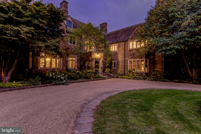 1601 Brintons Bridge Rd, Chadds Ford, PA 19317 - view of front facade featuring a front lawn, curved driveway, and a chimney