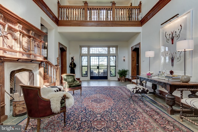 interior space with tile patterned flooring and a high ceiling