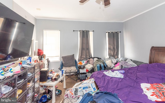 bedroom featuring ornamental molding, carpet floors, and ceiling fan