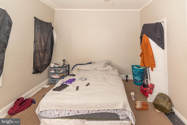 carpeted bedroom featuring crown molding