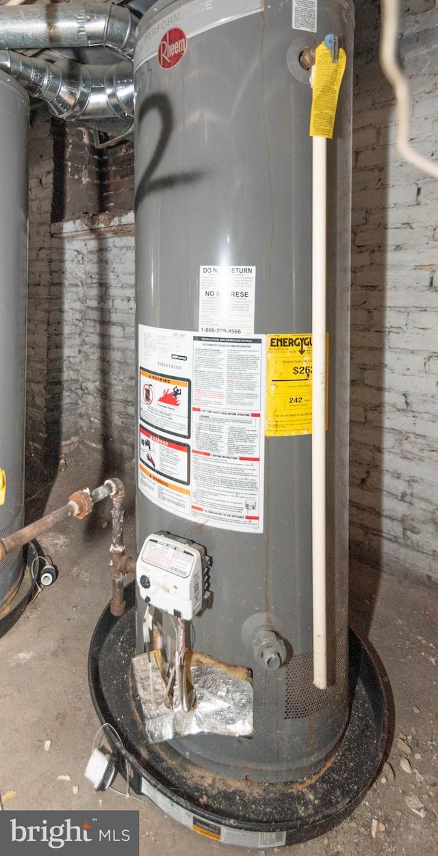 utility room featuring water heater