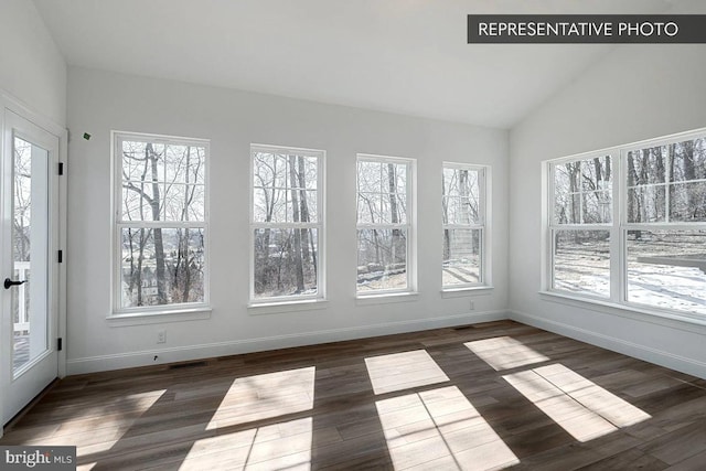 unfurnished sunroom featuring lofted ceiling