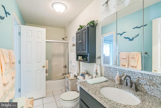 full bathroom featuring enclosed tub / shower combo, vanity, toilet, a textured ceiling, and tile patterned flooring