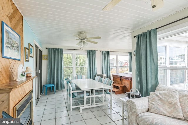 sunroom with ceiling fan and a healthy amount of sunlight