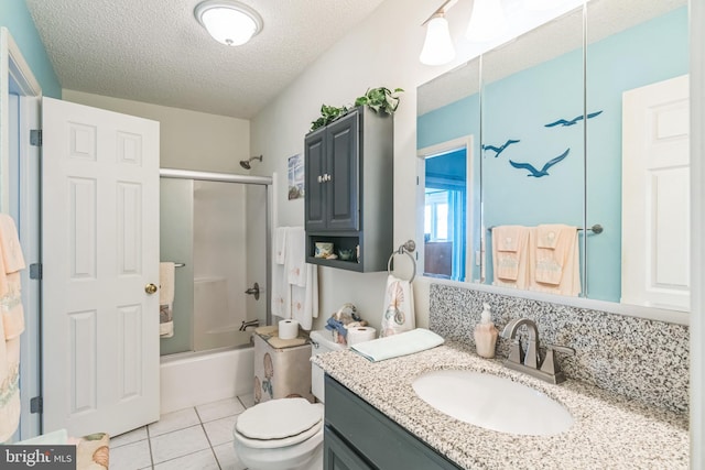 full bathroom with enclosed tub / shower combo, vanity, a textured ceiling, tile patterned floors, and toilet