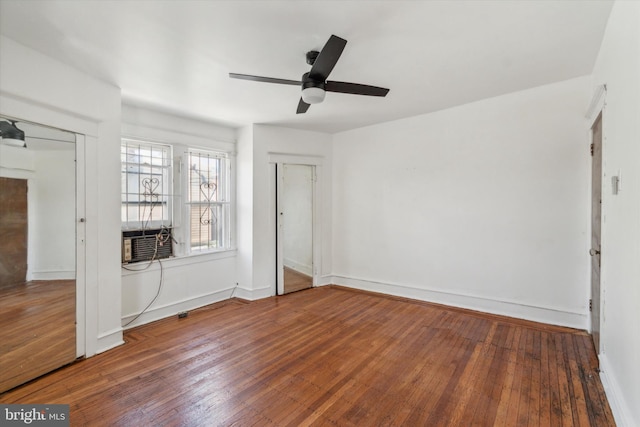 unfurnished bedroom with wood-type flooring, cooling unit, and ceiling fan