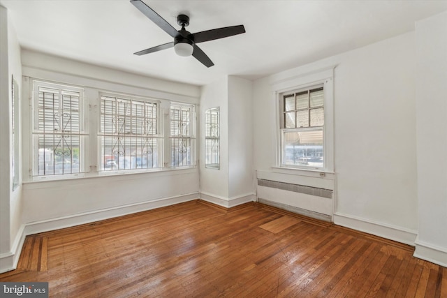 unfurnished room featuring ceiling fan and wood-type flooring