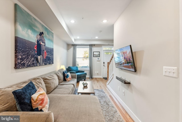 living room with light hardwood / wood-style flooring