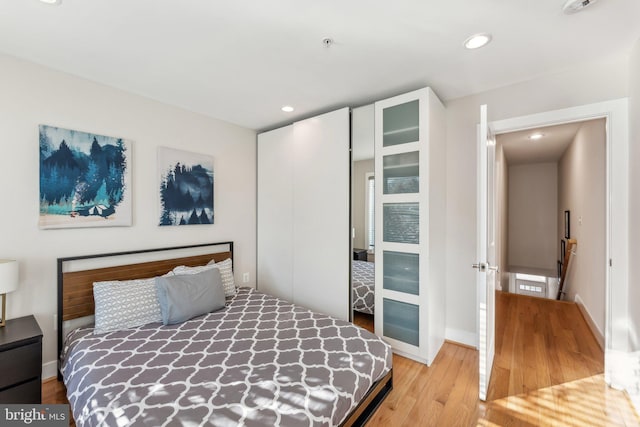 bedroom with light hardwood / wood-style flooring