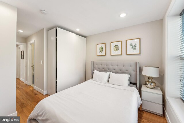 bedroom featuring light hardwood / wood-style floors