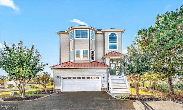 view of front of property with a garage