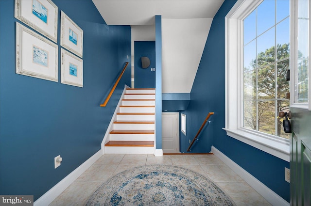 staircase with tile patterned floors