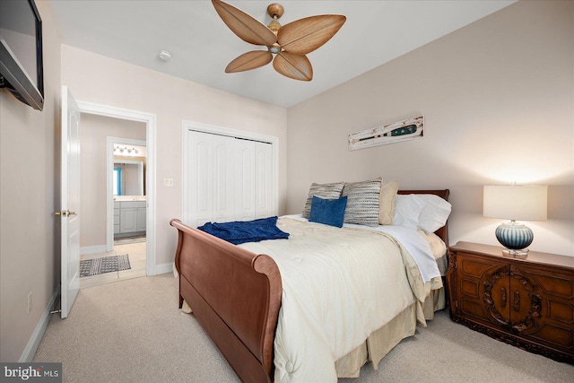 carpeted bedroom featuring a closet and ceiling fan