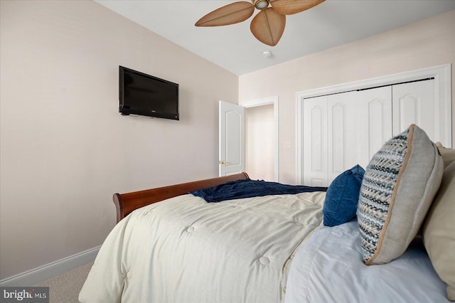 bedroom with carpet flooring, a closet, and ceiling fan