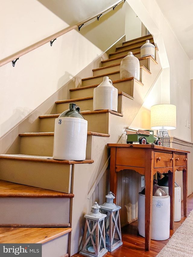 staircase with wood finished floors