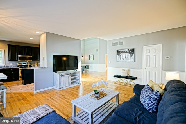 living room with light hardwood / wood-style floors