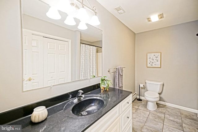 bathroom featuring vanity, tile patterned flooring, toilet, baseboard heating, and baseboards