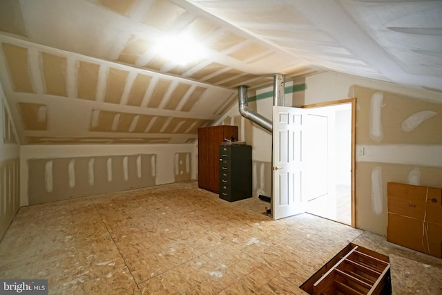 additional living space with vaulted ceiling