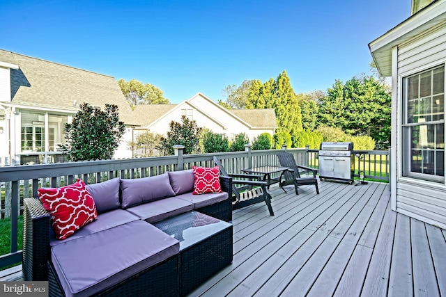 deck featuring an outdoor living space and area for grilling