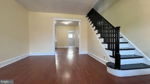 stairs with hardwood / wood-style flooring