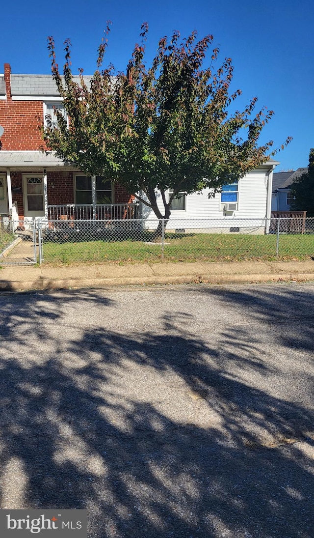 exterior space with a fenced front yard