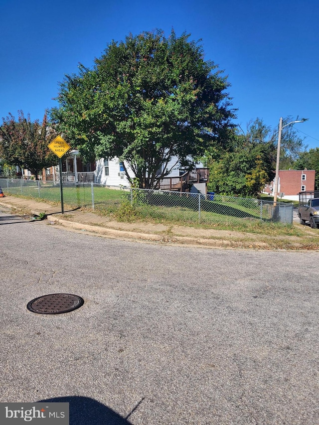 view of street with sidewalks and traffic signs