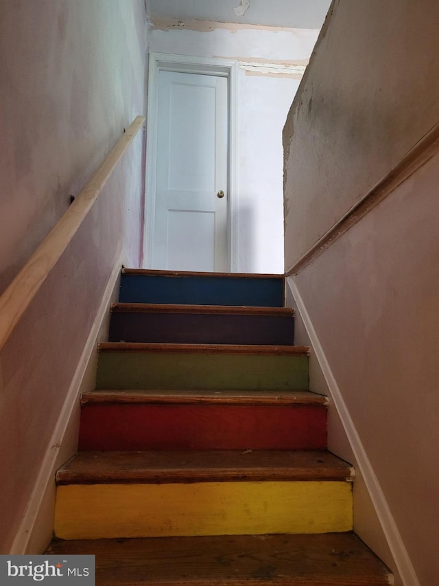 stairs with wood finished floors