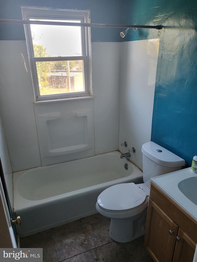 bathroom featuring shower / washtub combination, vanity, and toilet