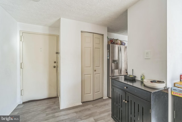 bathroom with vanity, hardwood / wood-style floors, and a textured ceiling