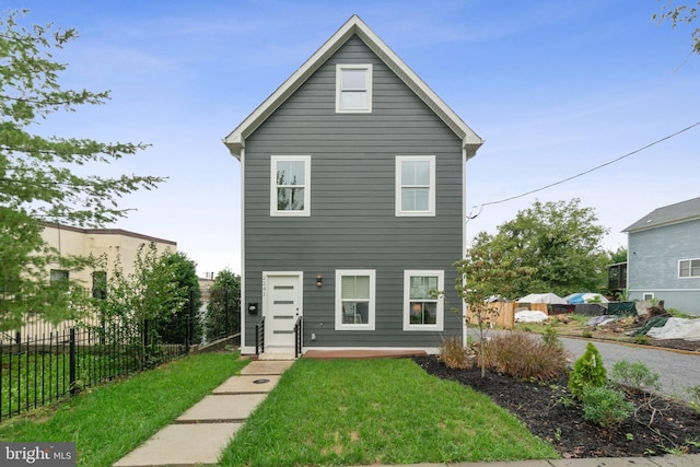 view of property with a front lawn