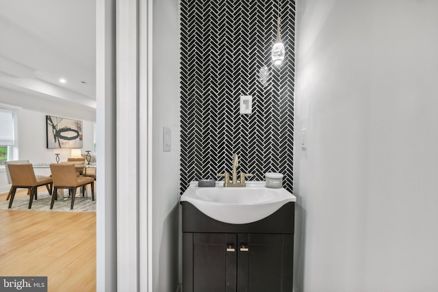 bathroom with vanity and wood-type flooring