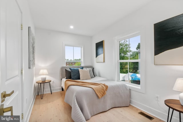 bedroom with light hardwood / wood-style flooring