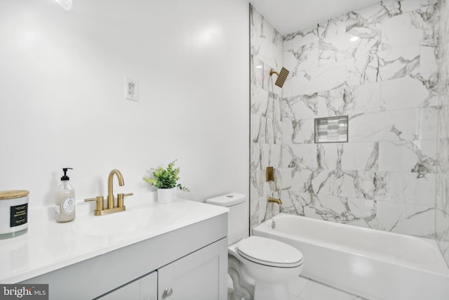 full bathroom featuring toilet, vanity, and tiled shower / bath