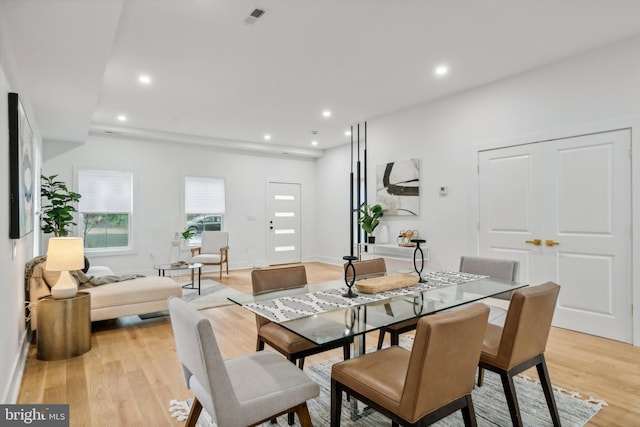 dining space featuring light wood-type flooring