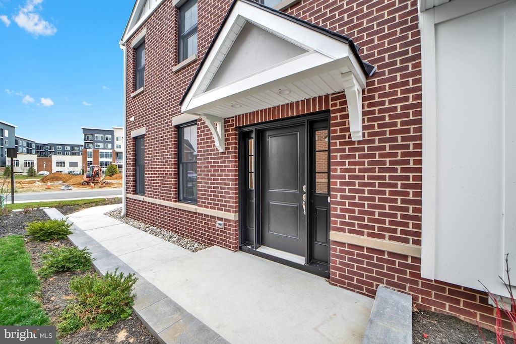 entrance to property with brick siding