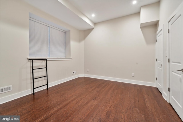 bonus room with dark hardwood / wood-style floors