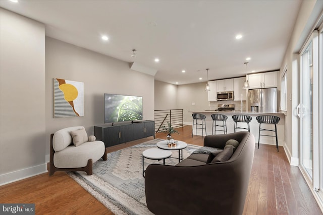 living room with hardwood / wood-style flooring