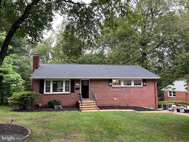 ranch-style home featuring a front yard