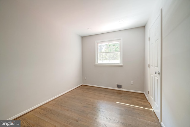 spare room with light hardwood / wood-style floors