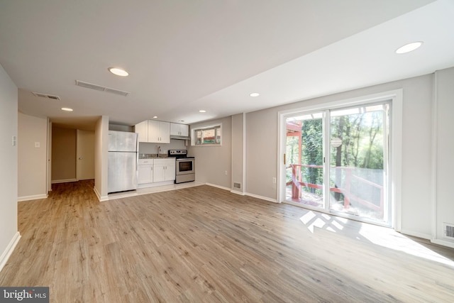 unfurnished living room featuring light wood-type flooring