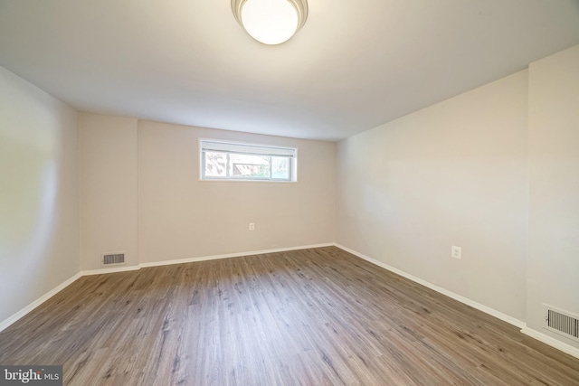 unfurnished room featuring hardwood / wood-style floors