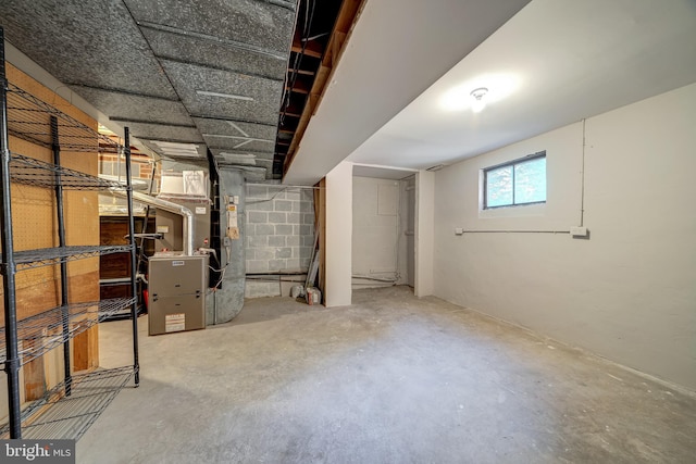 basement featuring heating unit