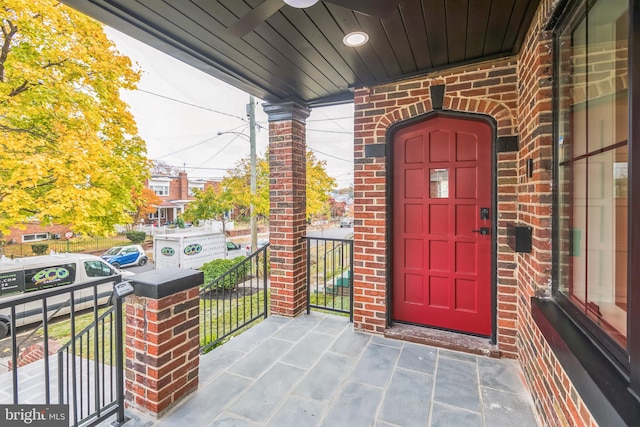 view of exterior entry featuring a porch