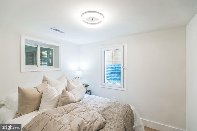 bedroom featuring multiple windows