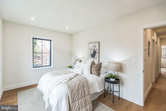 bedroom with hardwood / wood-style floors